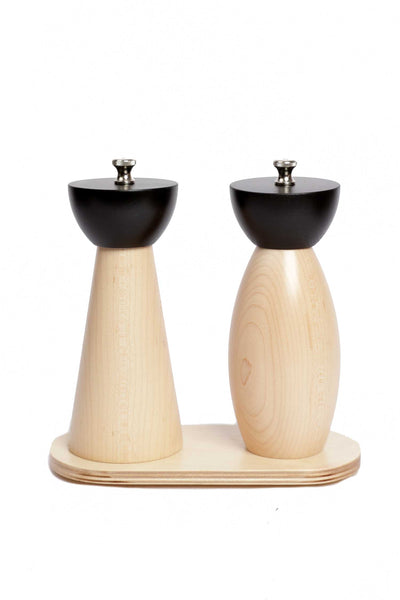 Minimalist, curved duo of black and natural  mills on stand