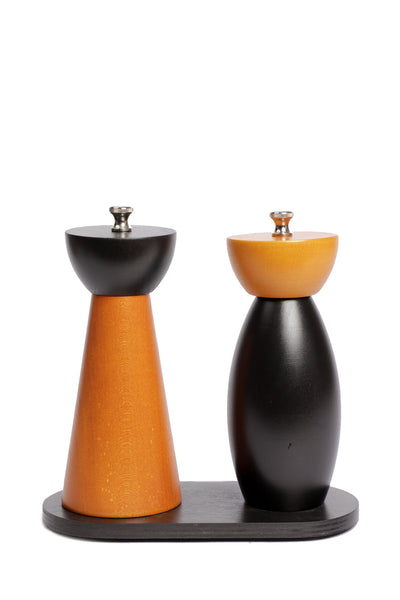 Duo of minimalist paprika and curved black mills on stand